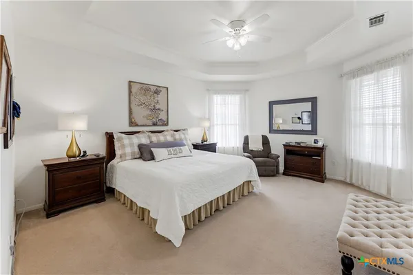 a bedroom with bed and window