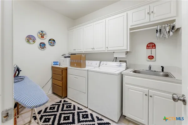 a bathroom with a sink mirror and vanity