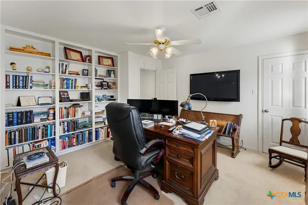 a view of a hallway with staircase