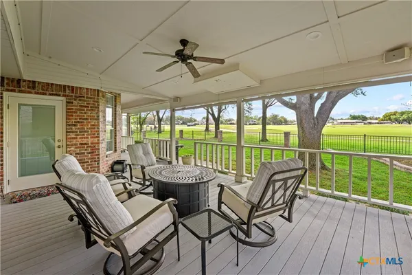 a view of balcony with floor to ceiling windows with wooden floor