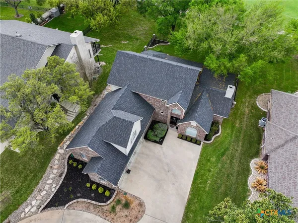 an aerial view of a houses with outdoor space and street view