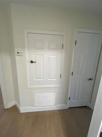 a bathroom with a glass door shower