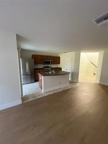 a view of a kitchen with a sink and dishwasher stove top oven