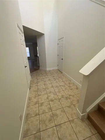 a view of entryway with stairs and wooden floor