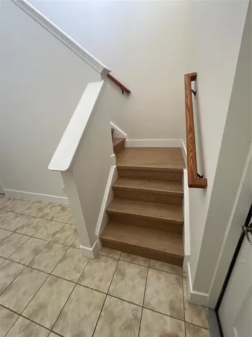a view of a hallway with staircase