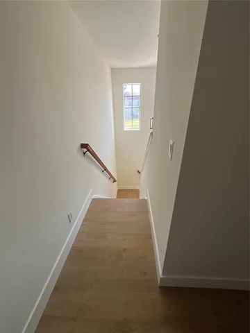 a spacious bathroom with a granite countertop sink and a mirror