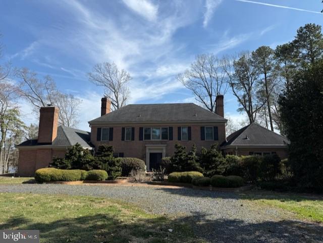 14135 Cooley Road Princess Anne, MD 21853 - Photo 1 of 15 a front view of a house with a garden