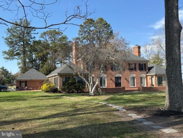 14135 Cooley Road Princess Anne, MD 21853 - Photo 2 of 15 a front view of a house with garden