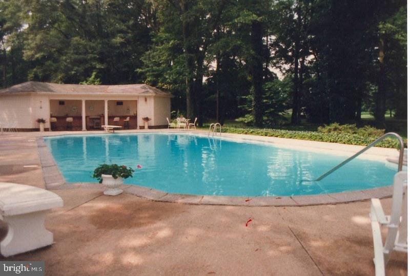 14135 Cooley Road Princess Anne, MD 21853 - Photo 4 of 15 a front view of a house with garden