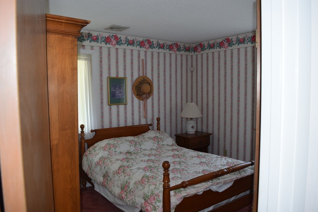 381 Albert Street Fall River, MA 02721 - Photo 17 of 21 a bedroom with a bed and a window