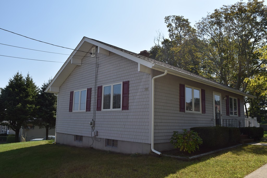 381 Albert Street Fall River, MA 02721 - Photo 4 of 21 a view of a house with a yard