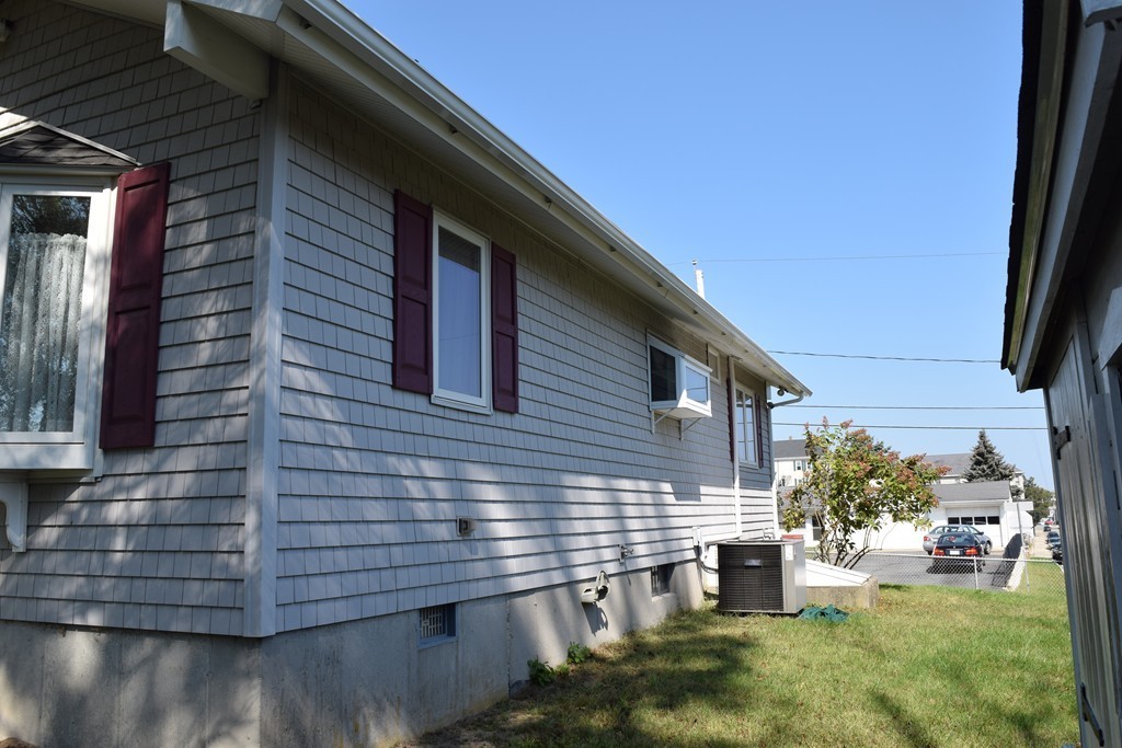 381 Albert Street Fall River, MA 02721 - Photo 6 of 21 a backyard of a house with seating space