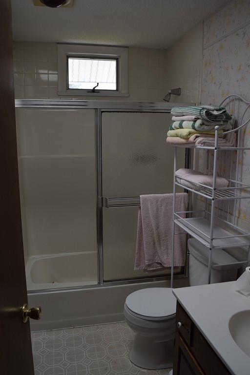 381 Albert Street Fall River, MA 02721 - Photo 10 of 21 a bathroom with a sink a toilet and shower