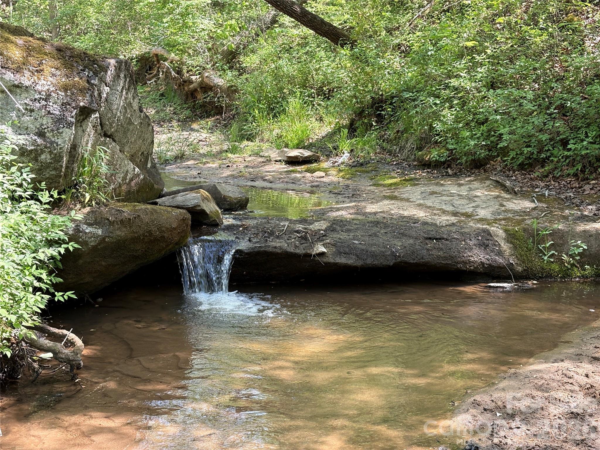 6 Hopewell Church Road, Unit 6 Hiddenite, NC 28636 - Photo 25 of 33 a view of a water fountain and a big yard
