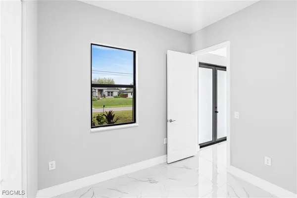 a view of a hallway with paintings on the wall