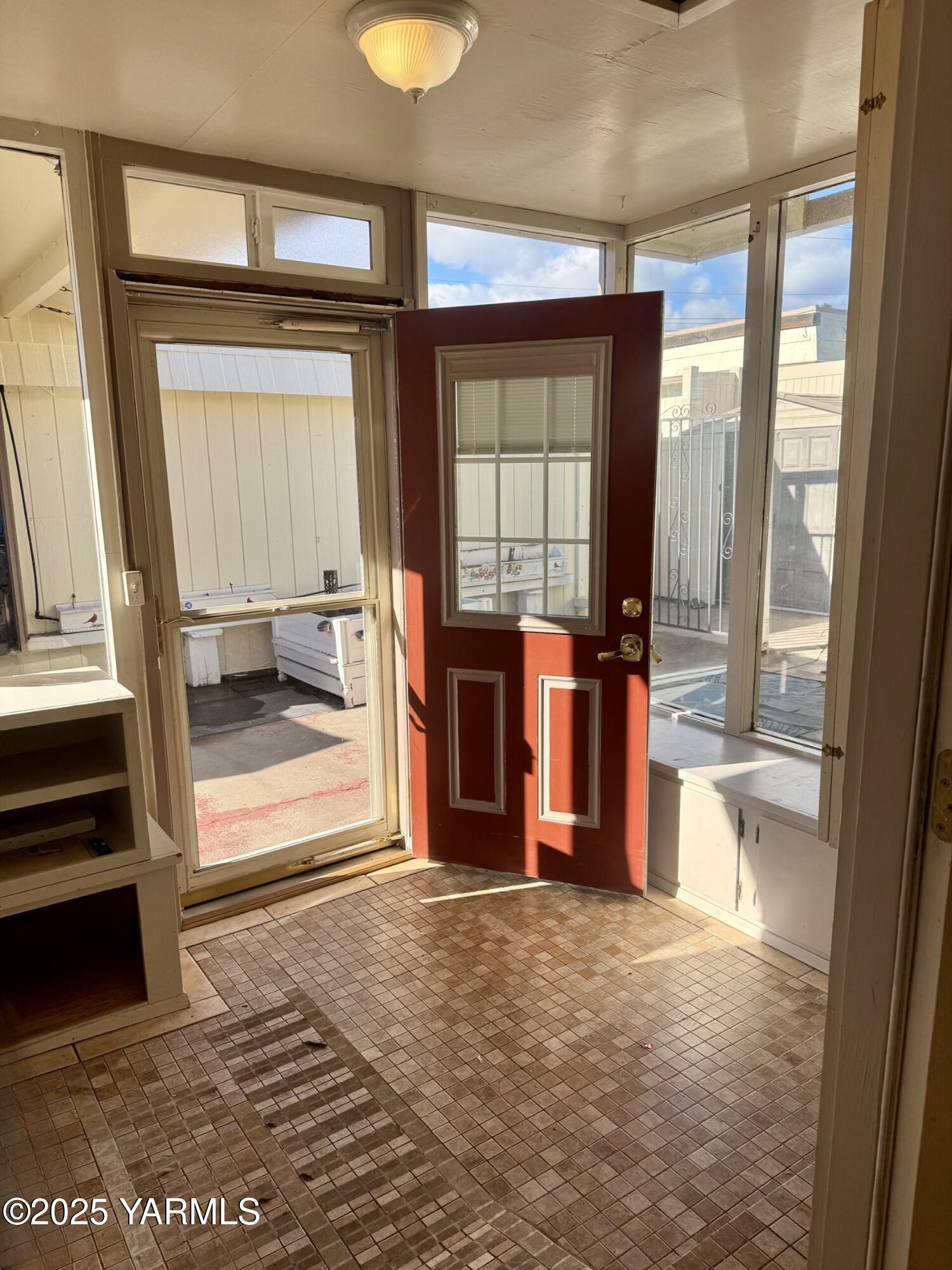 215 North 56th Avenue, Unit 5 Yakima, WA 98908 - Photo 22 of 31 a view of a bedroom with wooden floor and windows