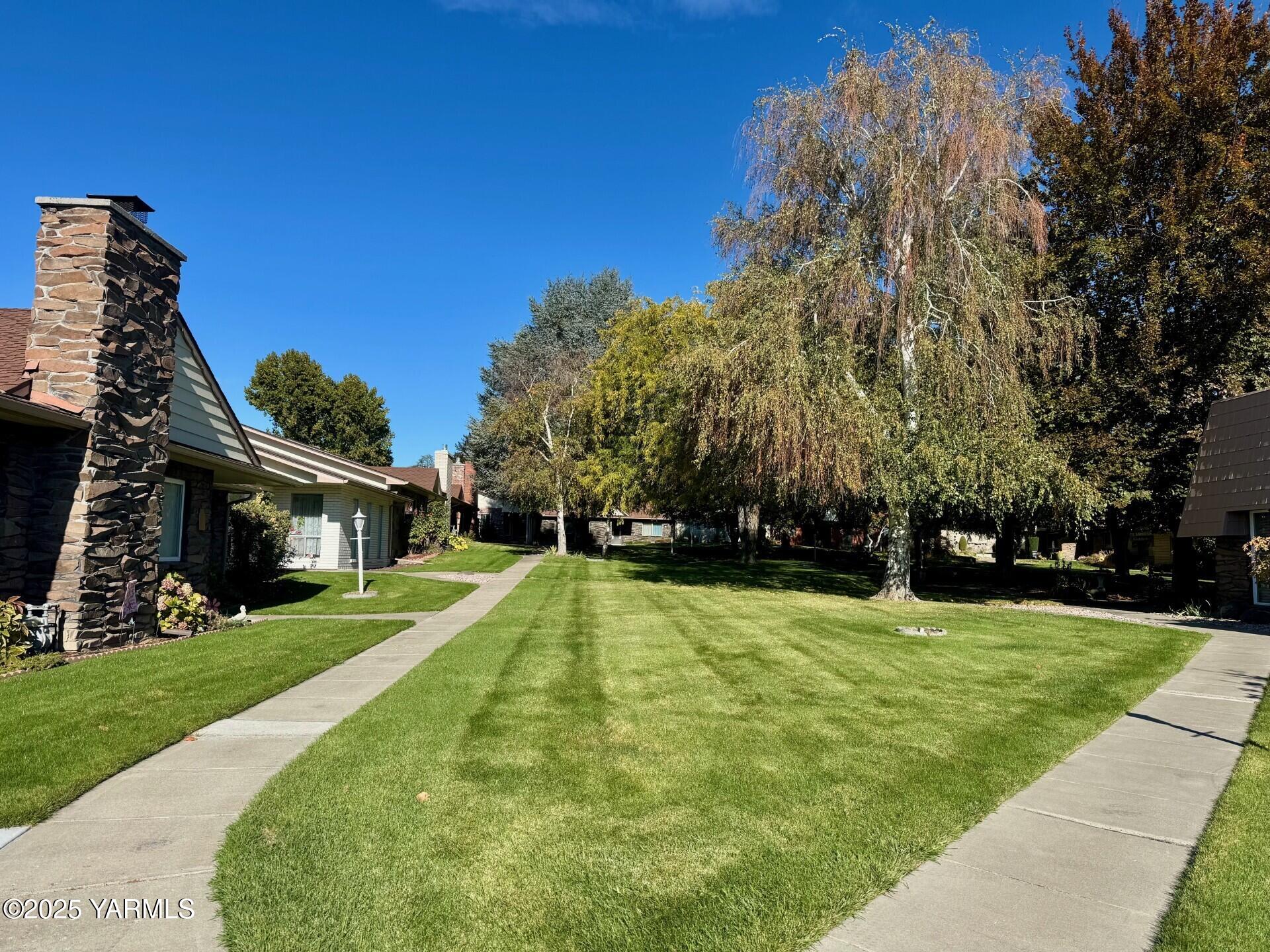 215 North 56th Avenue, Unit 5 Yakima, WA 98908 - Photo 31 of 31 a view of a house with a yard