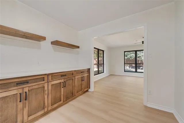 a view of a kitchen with cabinets