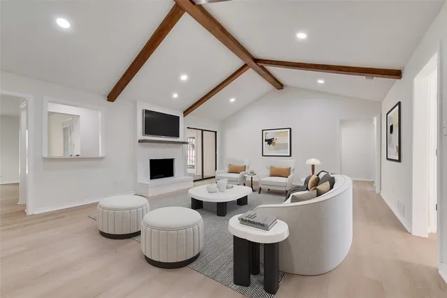 a living room with fireplace furniture and a flat screen tv