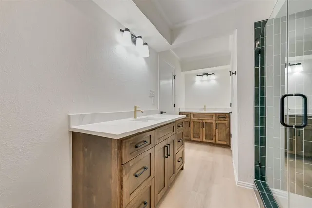 a bathroom with a double vanity sink a and mirror