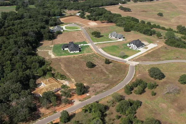 an aerial view of a house with outdoor space
