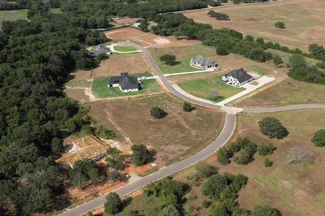 an aerial view of a house with outdoor space