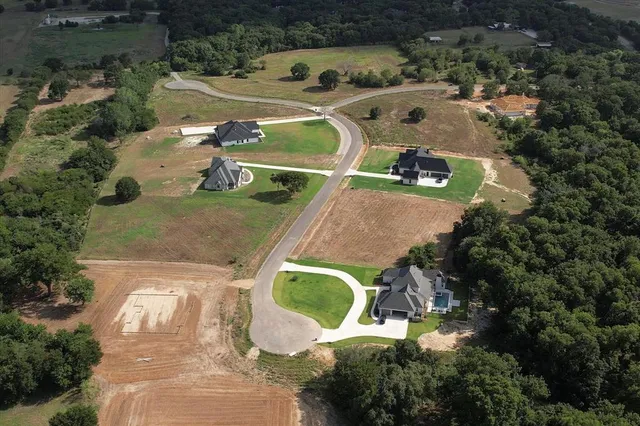 an aerial view of a house with outdoor space