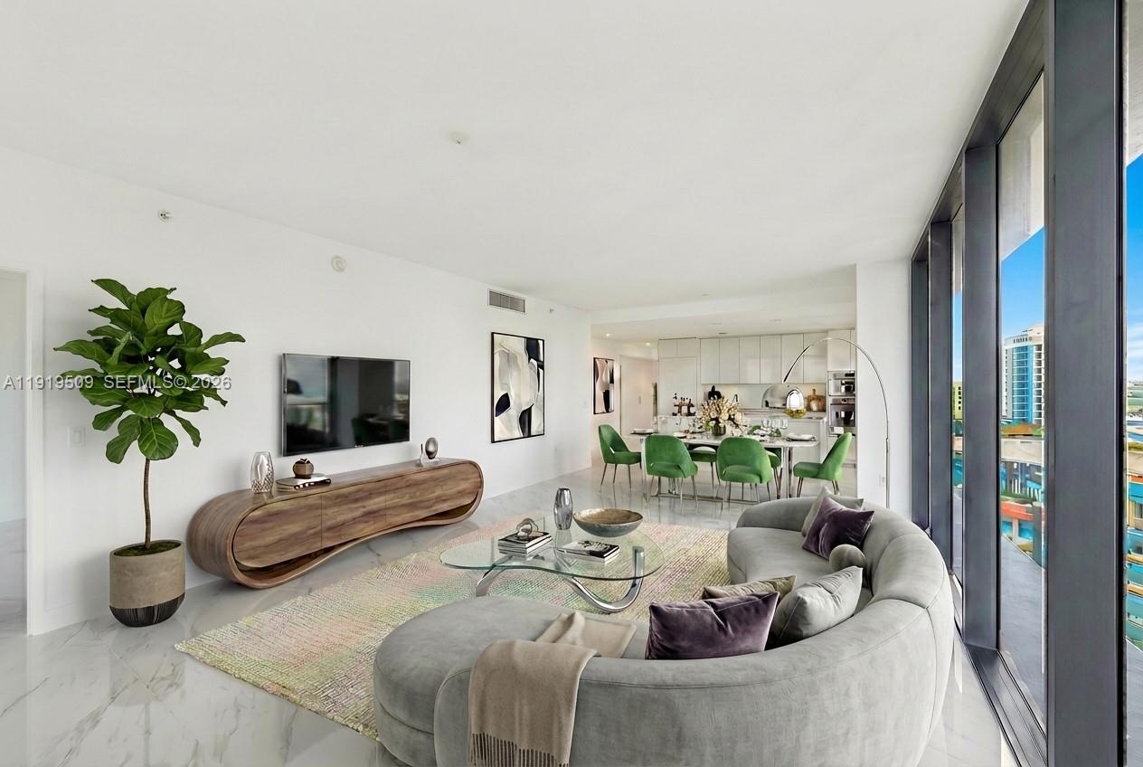700 Northeast 24th Street, Unit 1101 Miami, FL 33137 - Photo 13 of 66 a living room with furniture and a potted plant