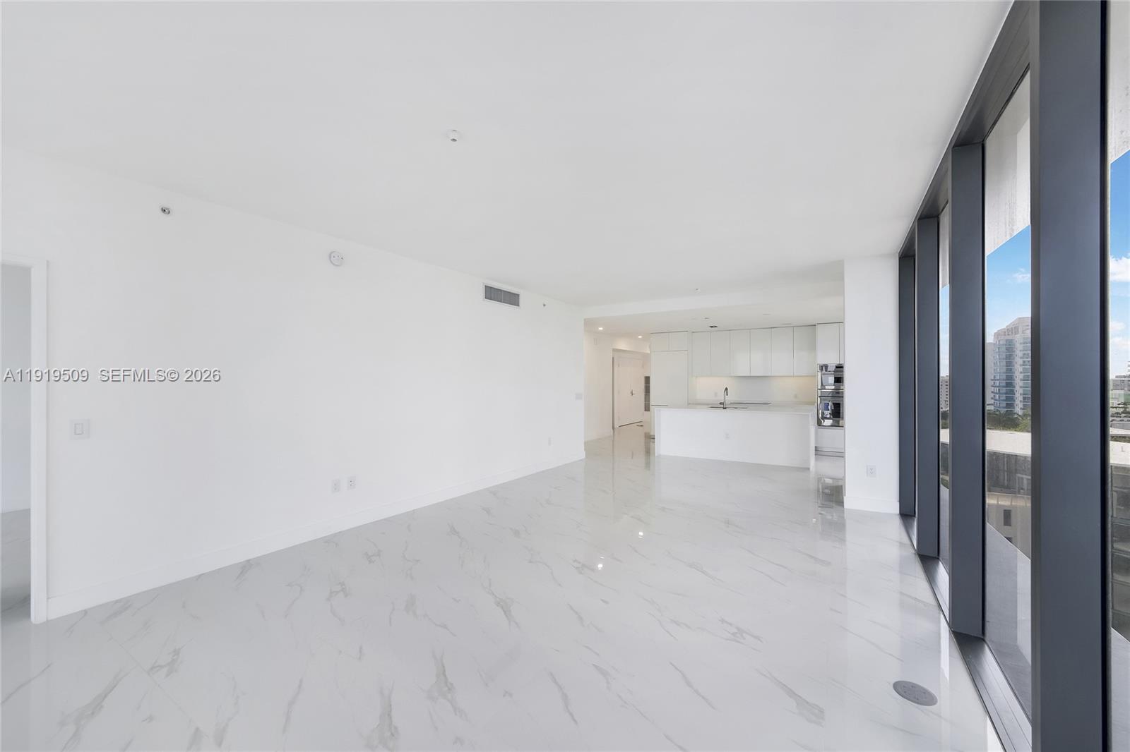 700 Northeast 24th Street, Unit 1101 Miami, FL 33137 - Photo 14 of 66 a view of a room with a cabinet and an empty room