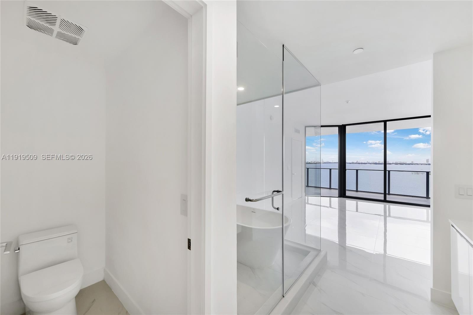 700 Northeast 24th Street, Unit 1101 Miami, FL 33137 - Photo 20 of 66 a bathroom with a toilet and a shower