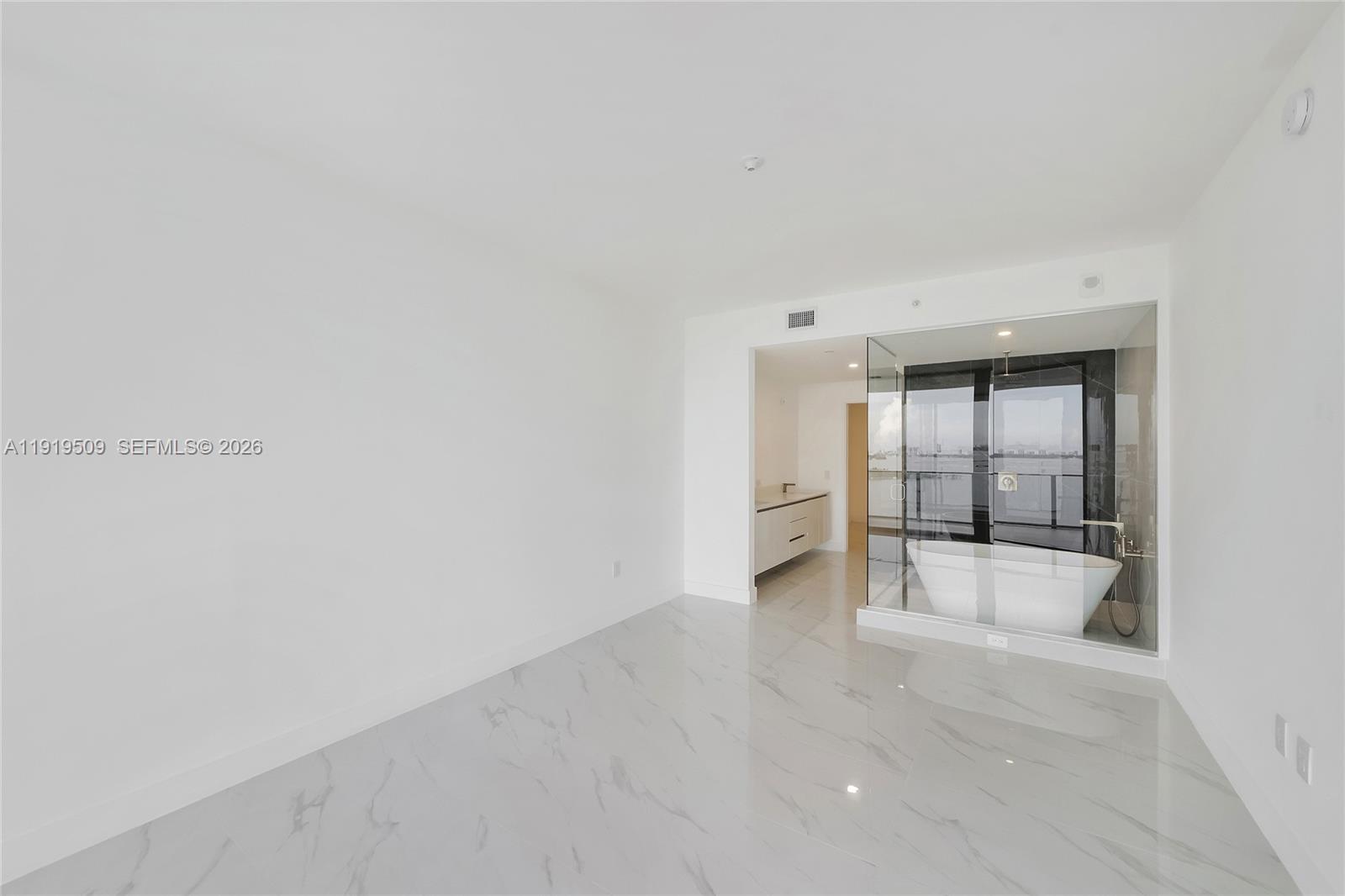 700 Northeast 24th Street, Unit 1101 Miami, FL 33137 - Photo 21 of 66 a view of an empty room with a fireplace
