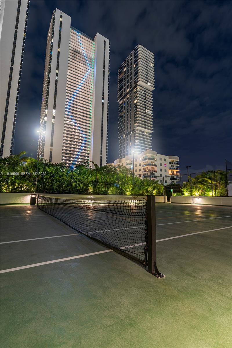 700 Northeast 24th Street, Unit 1101 Miami, FL 33137 - Photo 50 of 66 a front view of a building with a garden
