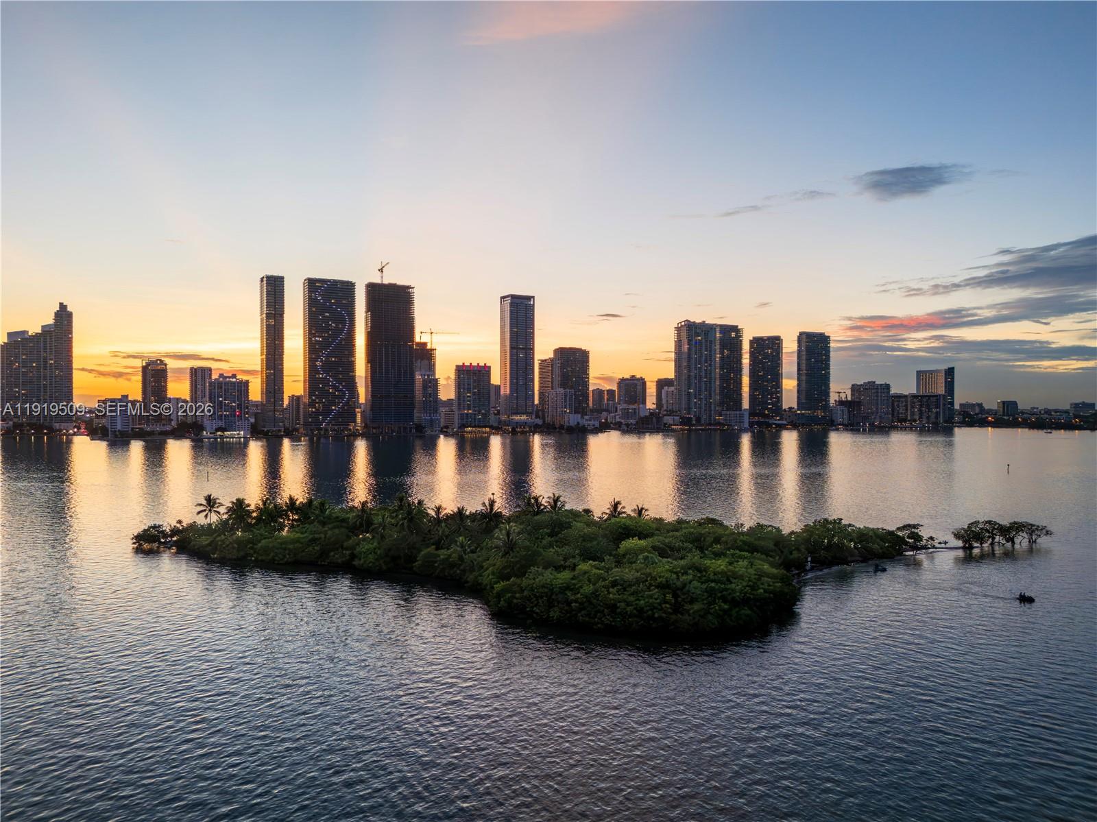 700 Northeast 24th Street, Unit 1101 Miami, FL 33137 - Photo 66 of 66 a view of a lake with tall building next to a lake