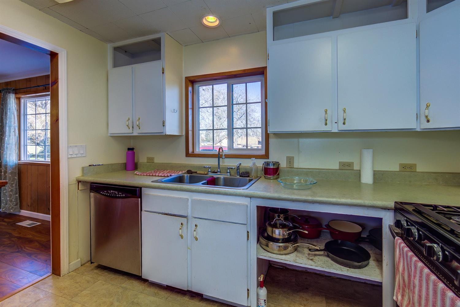 4149 Hilsinger Road Phoenix, OR 97535 - Photo 8 of 35 a kitchen with stainless steel appliances granite countertop a stove and a microwave