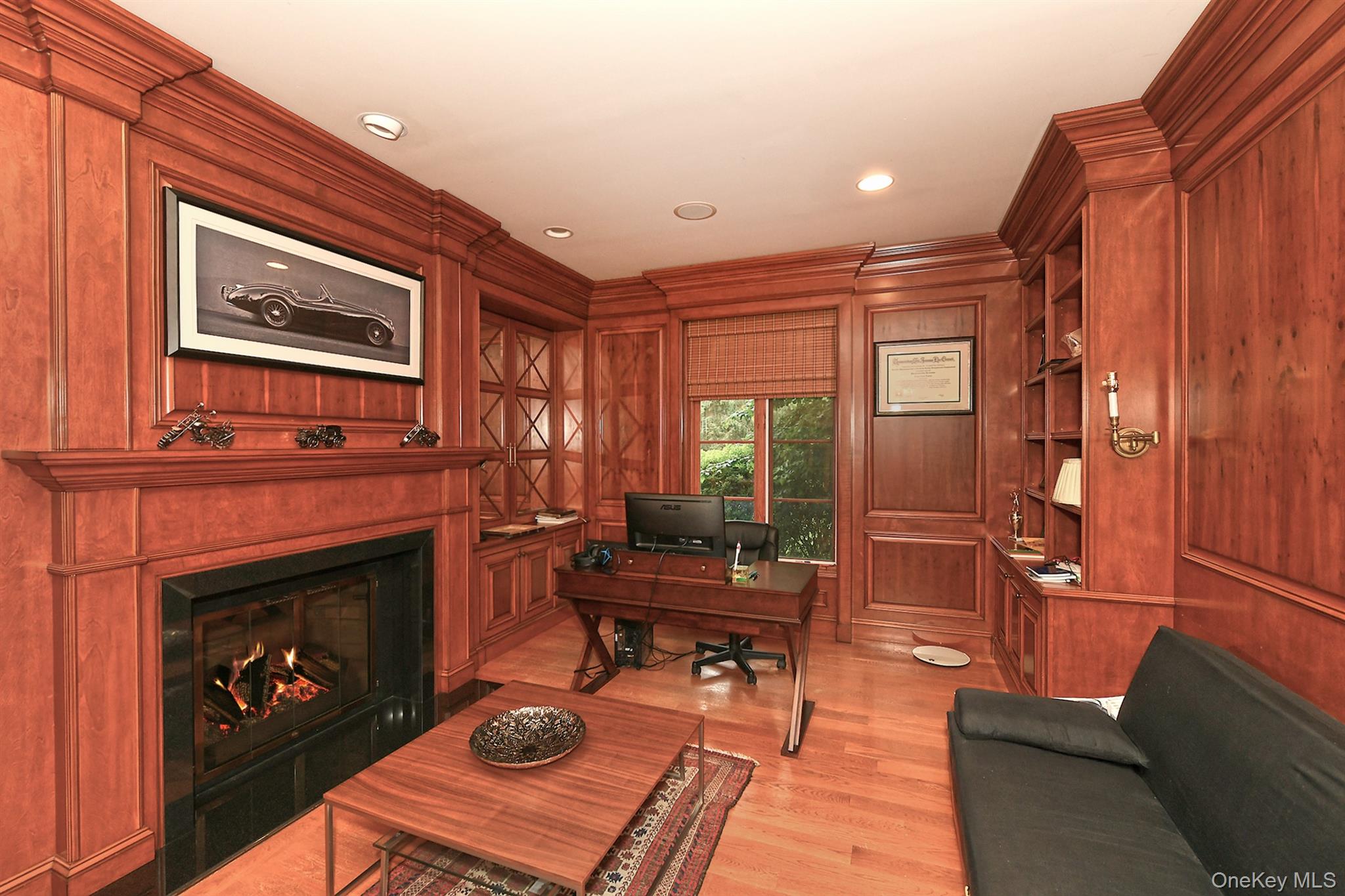 14 Norgate Road Glen Head, NY 11545 - Photo 11 of 44 a living room with furniture a fireplace and a window