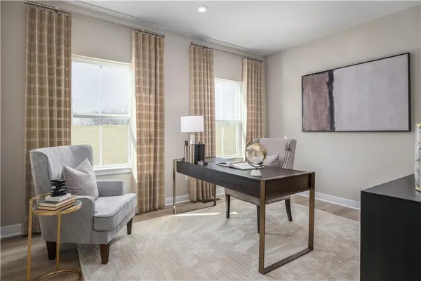 a living room with furniture a table and a large window