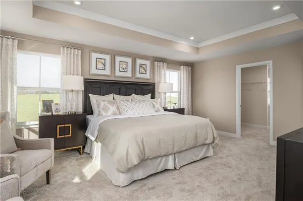 a bedroom with a bed and a couch