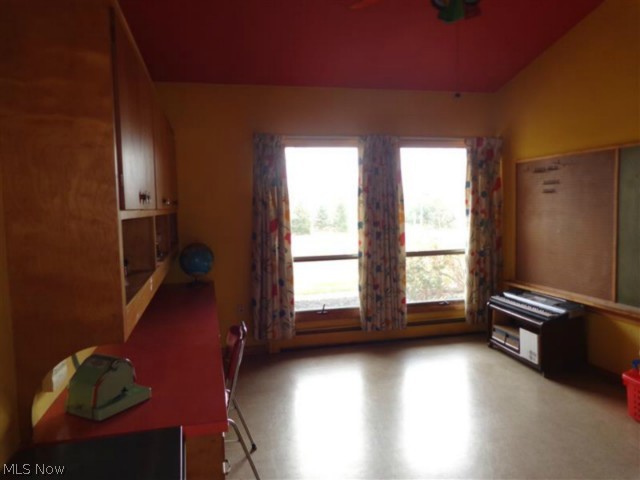 8819 Diagonal Road Streetsboro, OH 44241 - Photo 15 of 23 This photo is a bit dark because of the light from the window. The owner's wisdom is evident in providing a kid playroom with built-in desk, shelves, cupboards and even chalkboard and bulletin board located directly off the kitchen area.
