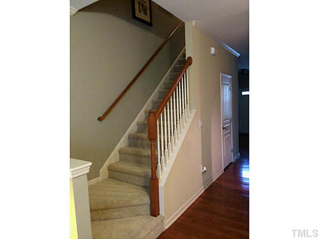 7610 Winners Edge Street Raleigh, NC 27617 - Photo 8 of 17 a view of a hallway with staircase