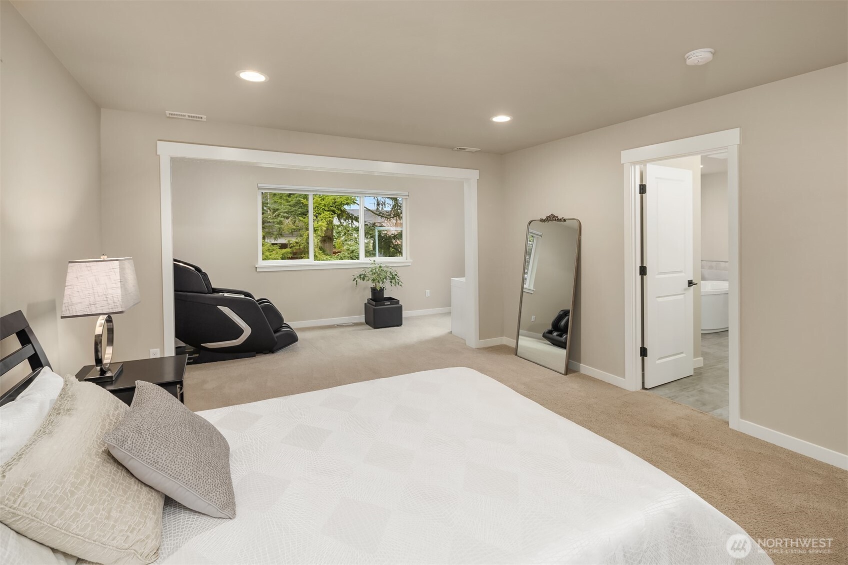 1435 242nd Place Southeast Bothell, WA 98021 - Photo 26 of 40 a bedroom with a bed a table and chair