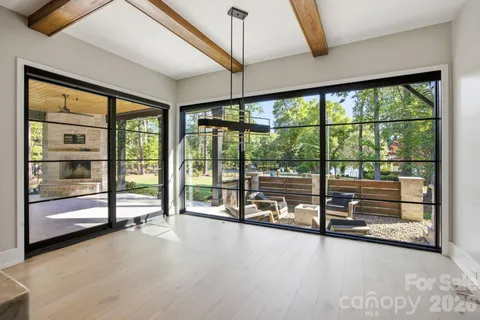 a room with window and pool view