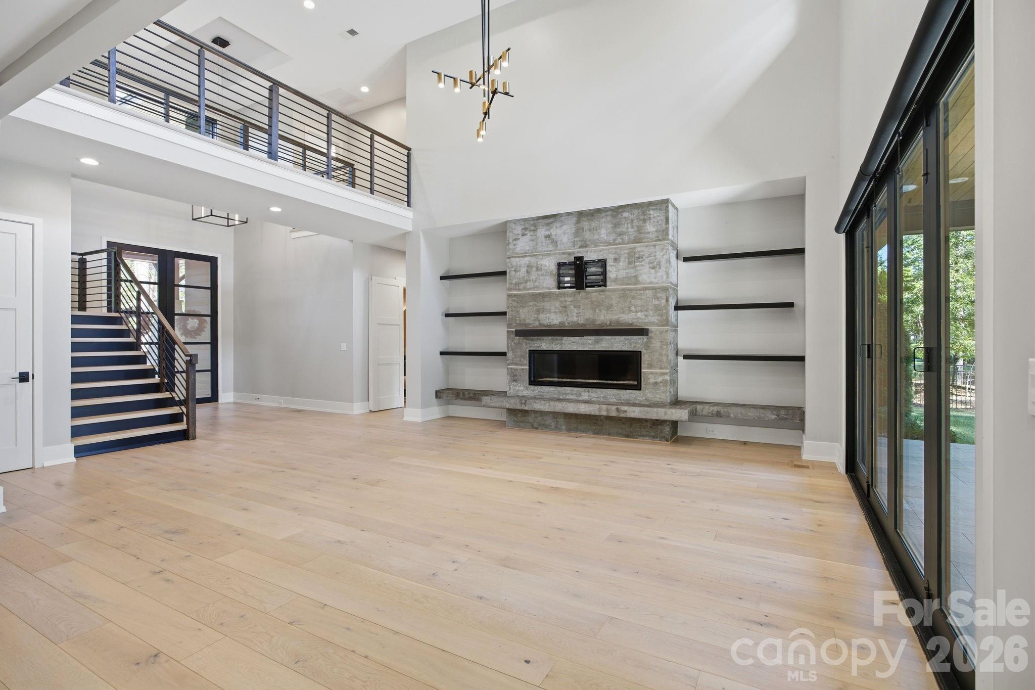 132 Binns Road Mooresville, NC 28117 - Photo 13 of 48 a view of a hallway with stairs and a living room