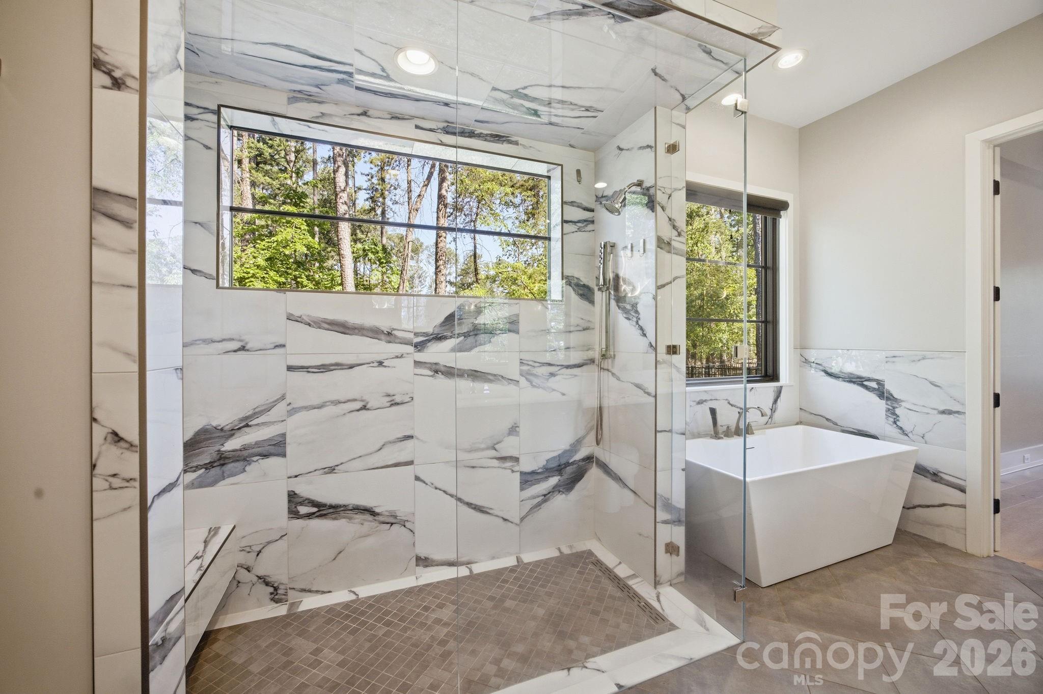 132 Binns Road Mooresville, NC 28117 - Photo 26 of 48 a bath room with a bath tub and a shower