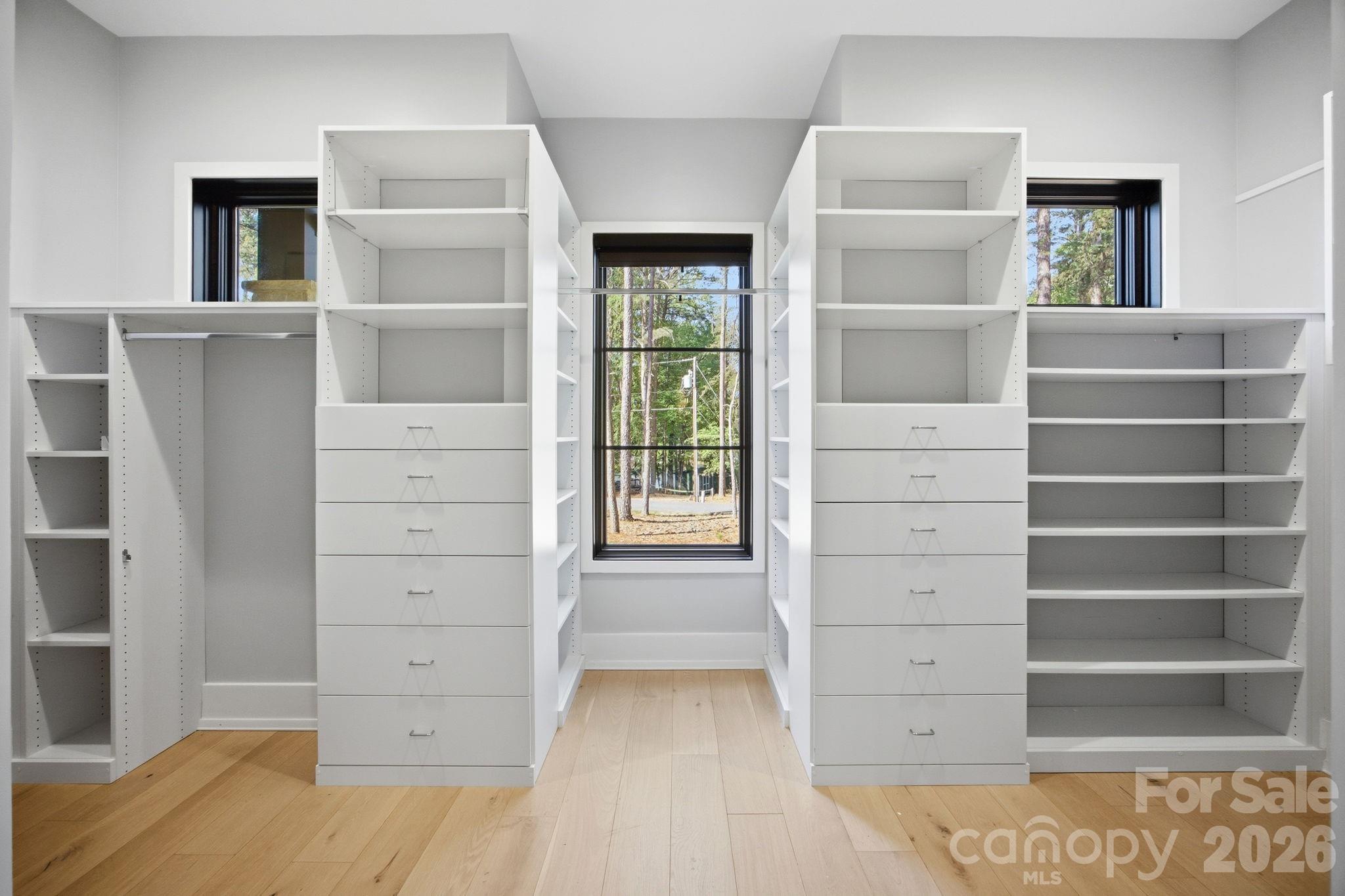 132 Binns Road Mooresville, NC 28117 - Photo 27 of 48 a view of walk in closet with empty racks