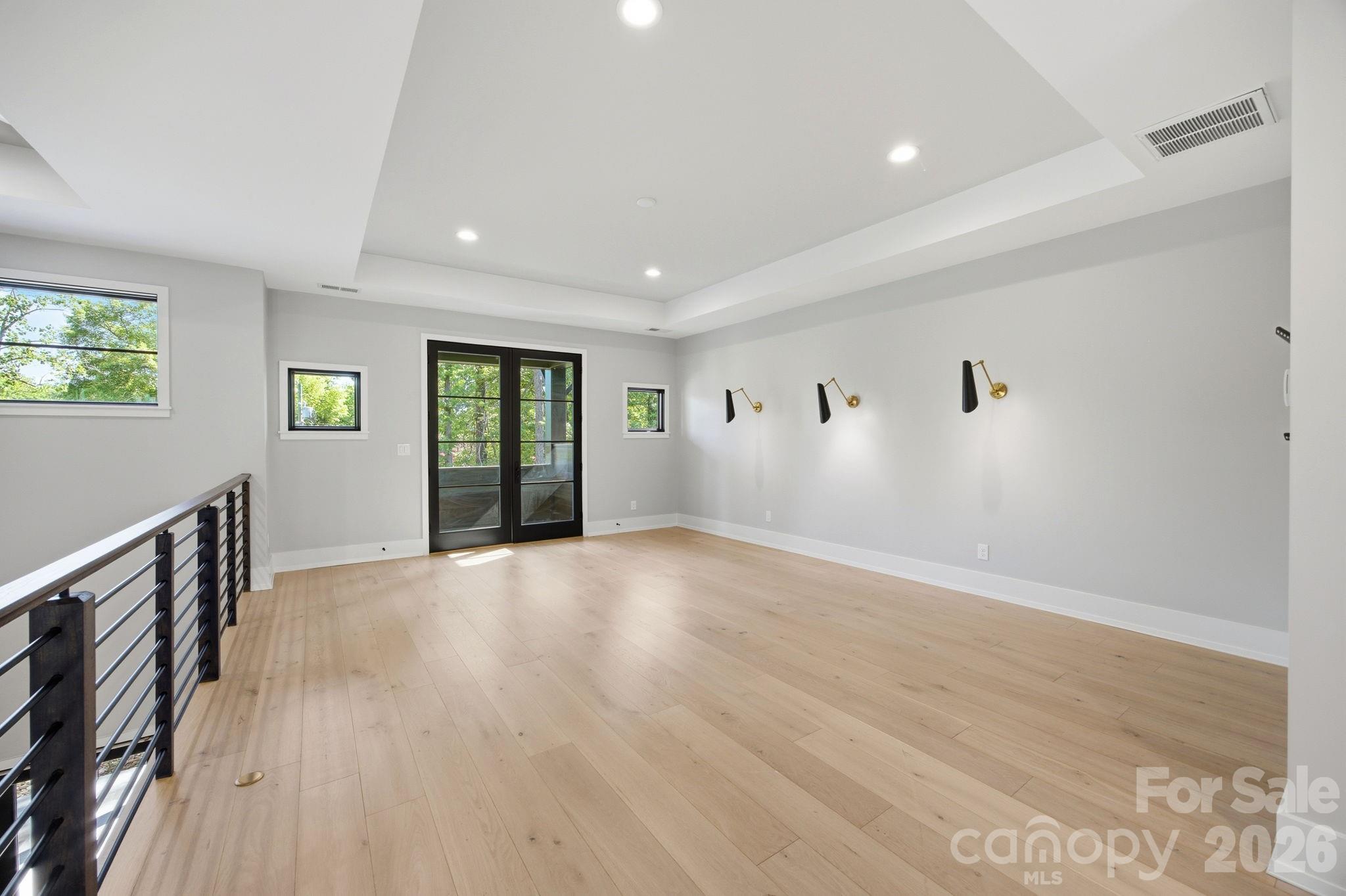 132 Binns Road Mooresville, NC 28117 - Photo 29 of 48 a view of an empty room with wooden floor and a window