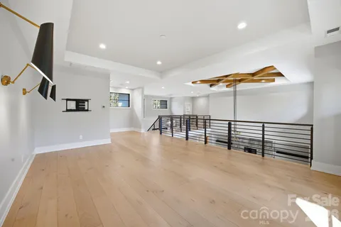 a view of a livingroom with furniture and staircase