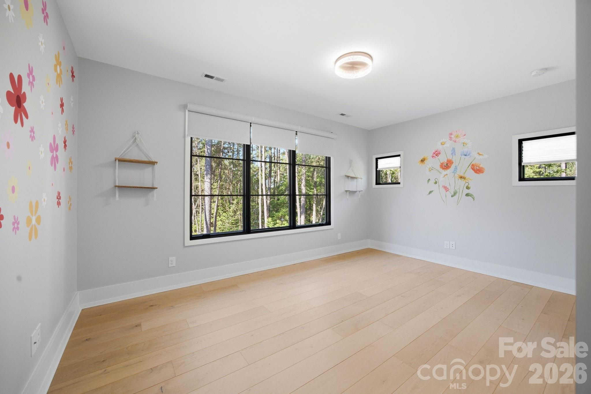 132 Binns Road Mooresville, NC 28117 - Photo 32 of 48 a view of an empty room with a window