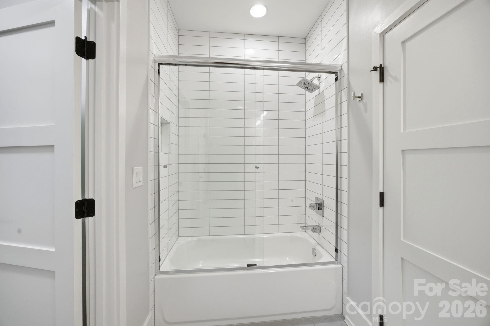 132 Binns Road Mooresville, NC 28117 - Photo 34 of 48 a bathroom with a shower and a tub