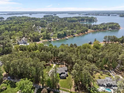 an aerial view of a city with lots of residential buildings lake and ocean view