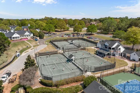 a view of multiple houses with outdoor space